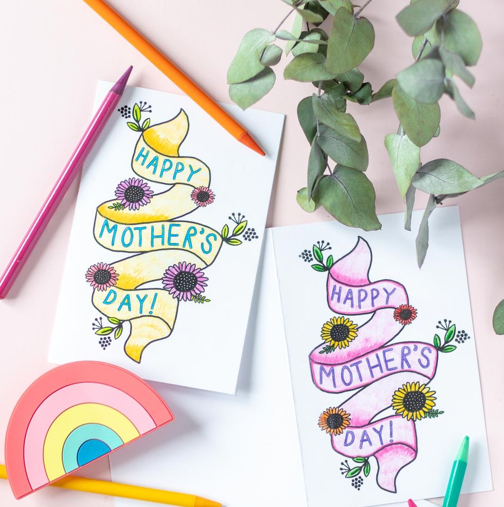 printable color it yourself card with the words happy mothers day on a banner surrounded by flowers