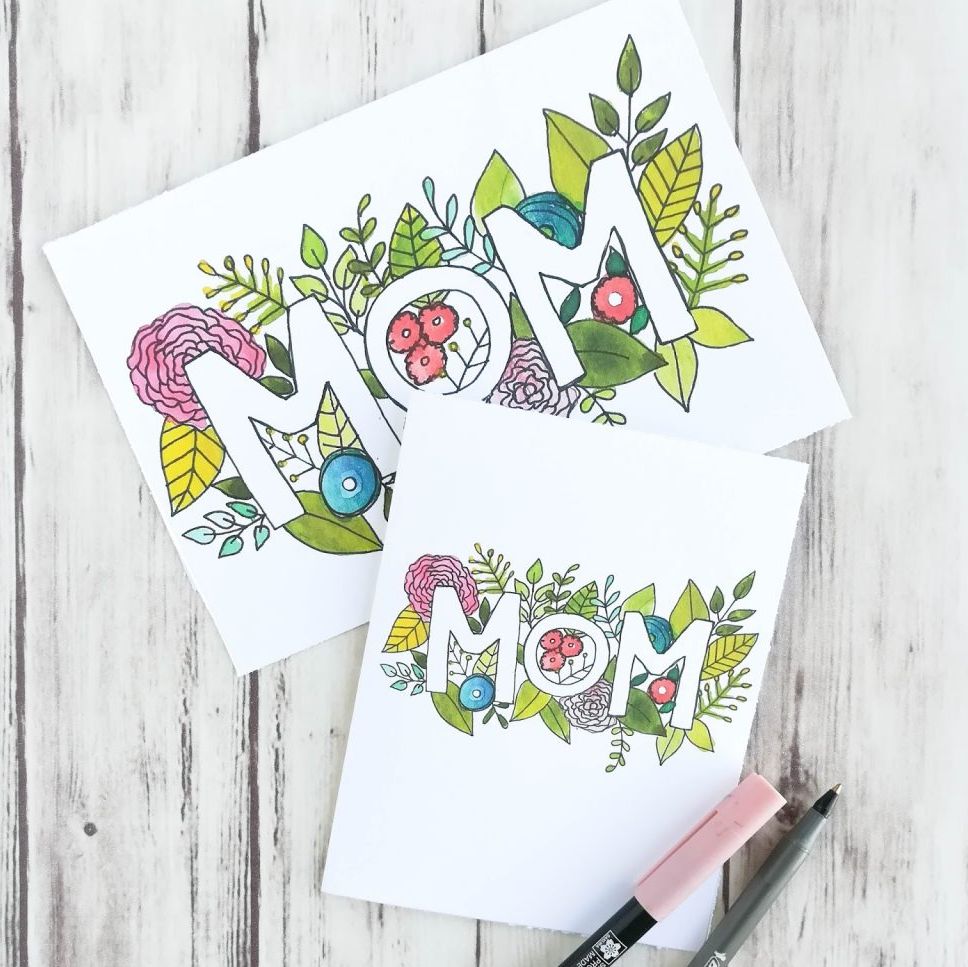 printable mother's day card with colorful folksy botanical illustration around all caps white letters spelling out mom