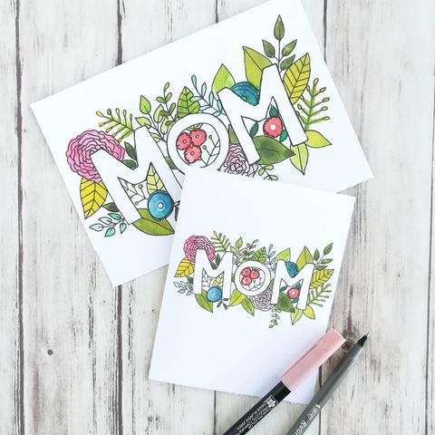 a mothers day card that says mom with flowers all around that you can color in yourself