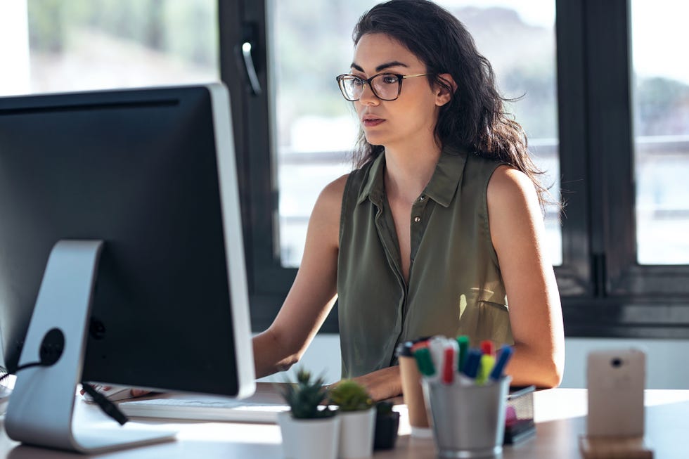 shot of concentrated young business woman working with computer in the office