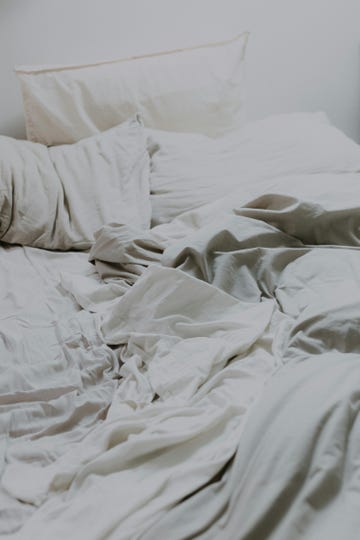 a bed with white sheets