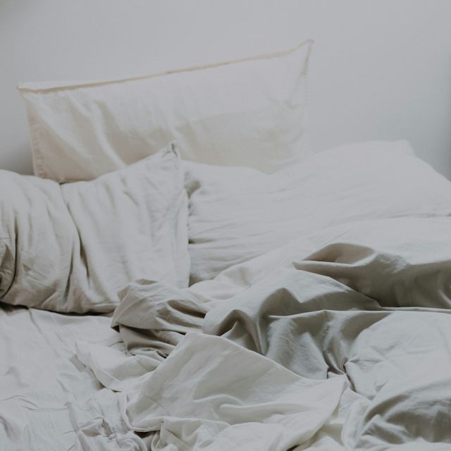 a bed with white sheets