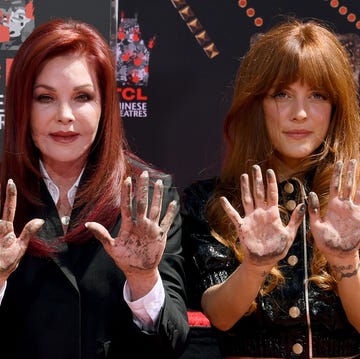 Priscilla Presley and Riley Keough in June 2022 priscilla presley and riley keough look at the camera with their concrete covered palms out