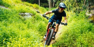 male mountain biker riding trail