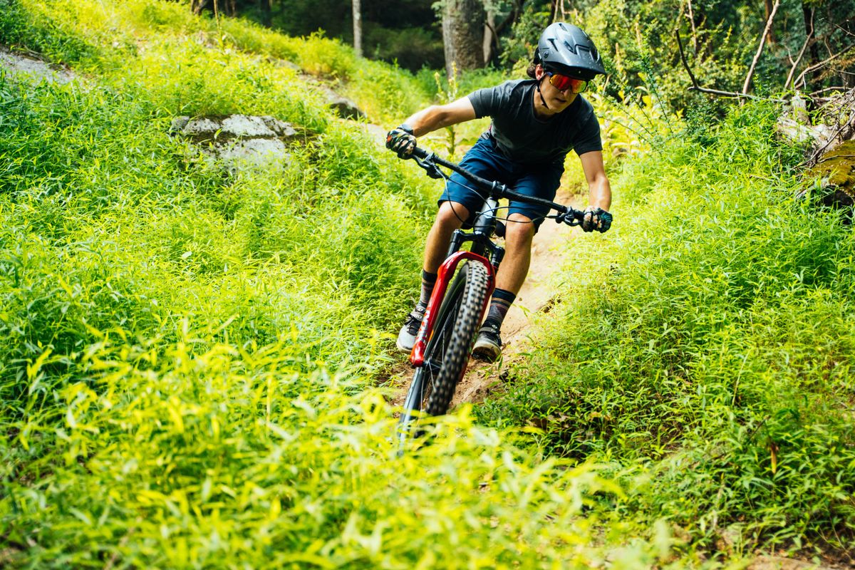 male mountain biker riding trail