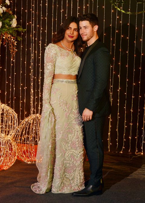 Priyanka Chopra and Nick Jonas pose for cameras at their Reception