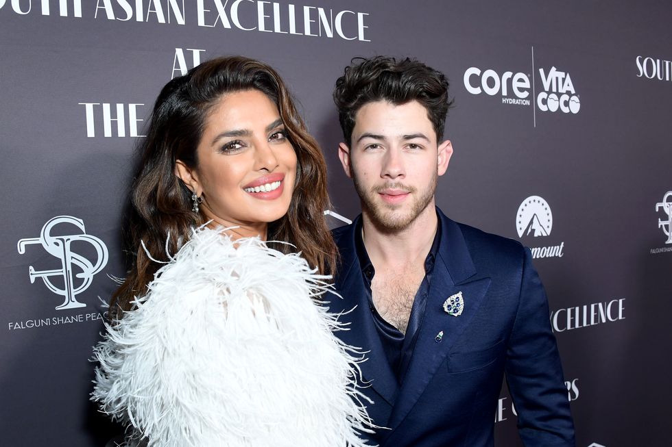 nick jonas poses next to wife priyanka chopra jonas