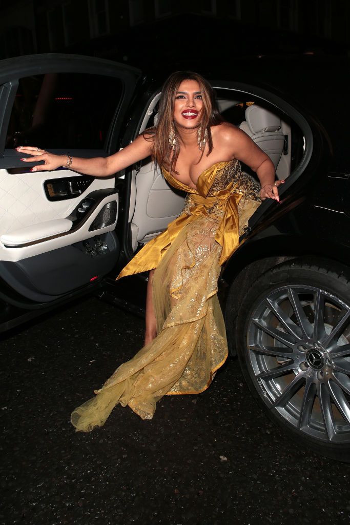 Priyanka Chopra Wears Plungig Gold Gown in London