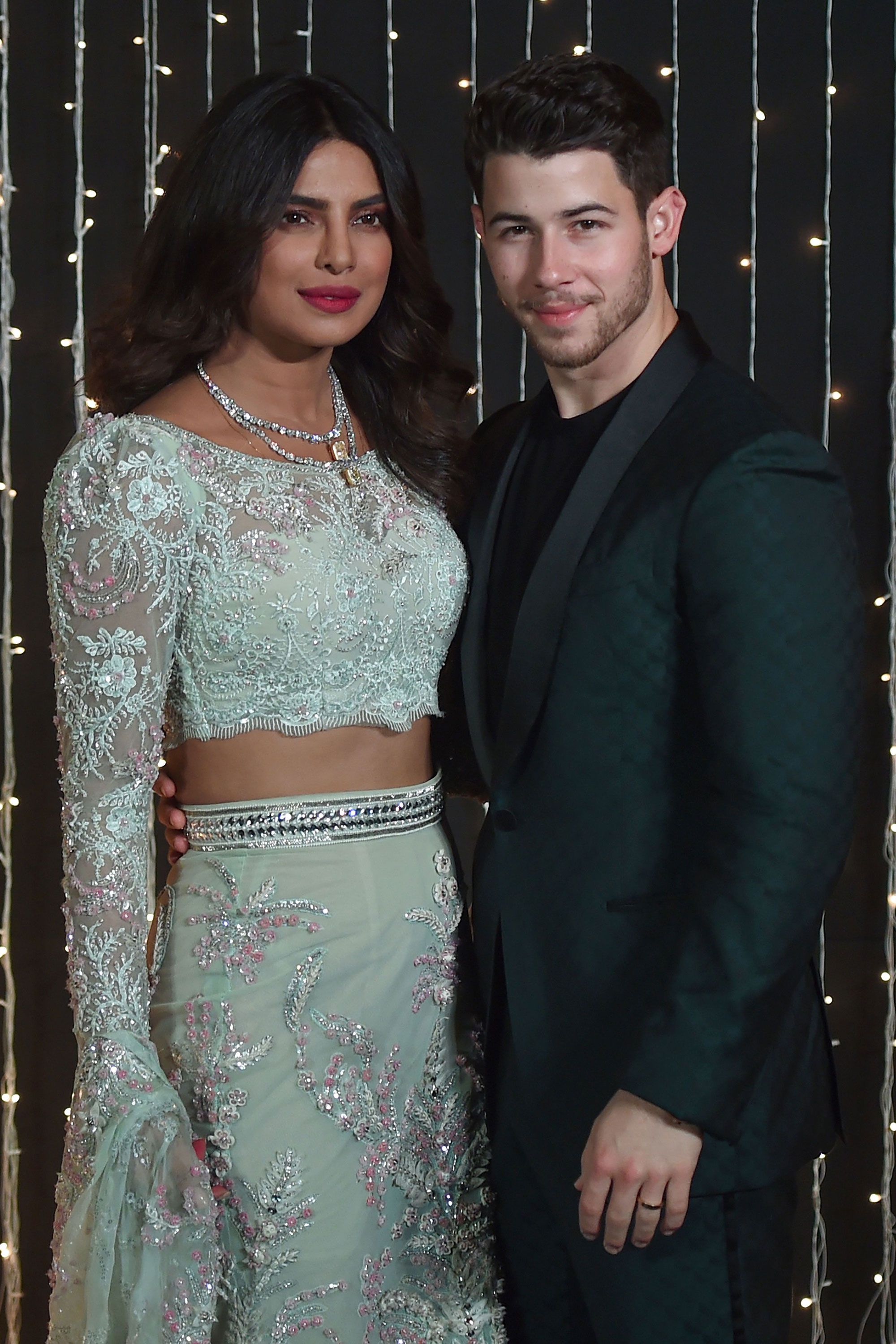 Priyanka Chopra wore her backless white wedding reception gown with a  crystal cape | VOGUE India