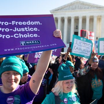 a person holding a sign that says pro freedom pro justice pro choice naral outside the supreme court