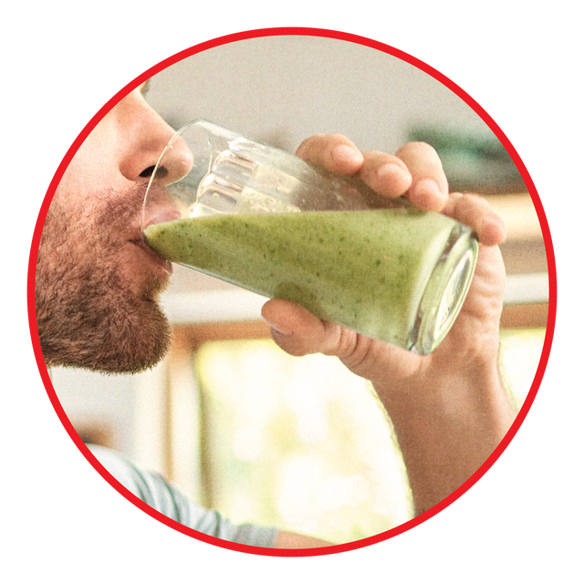 man drinking green smoothie