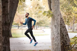 professional athlete jogging in nature