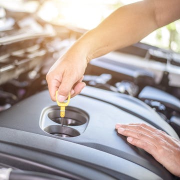 Professional mechanic checking car engine