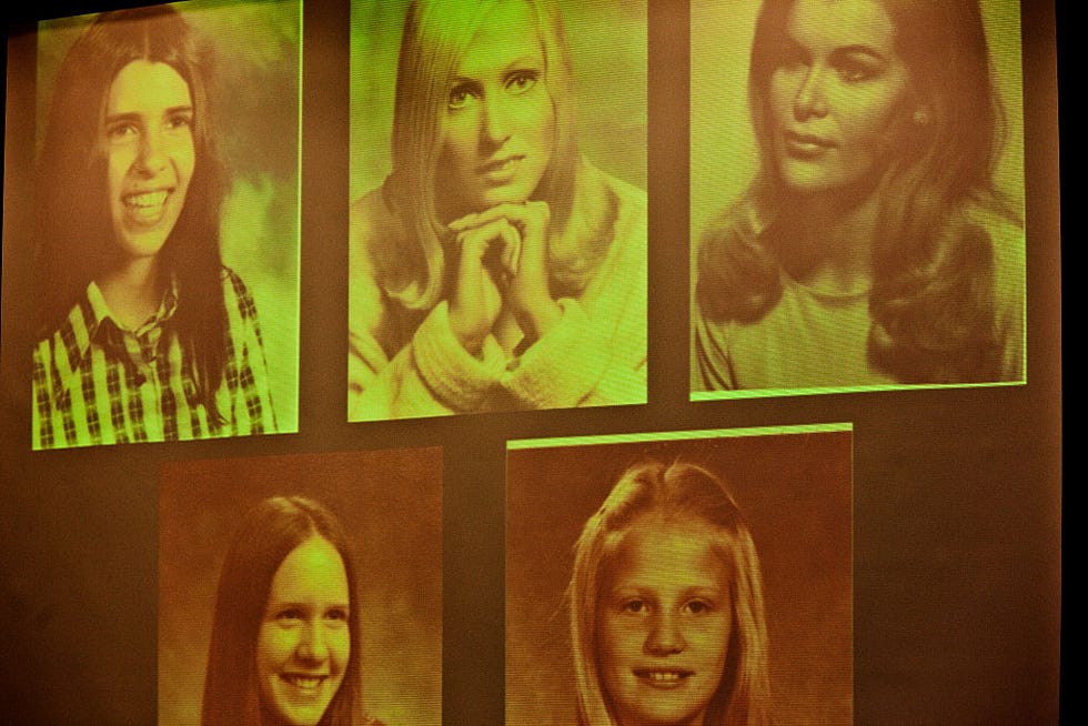 projected images of five young women and girls, the projection has a green cast