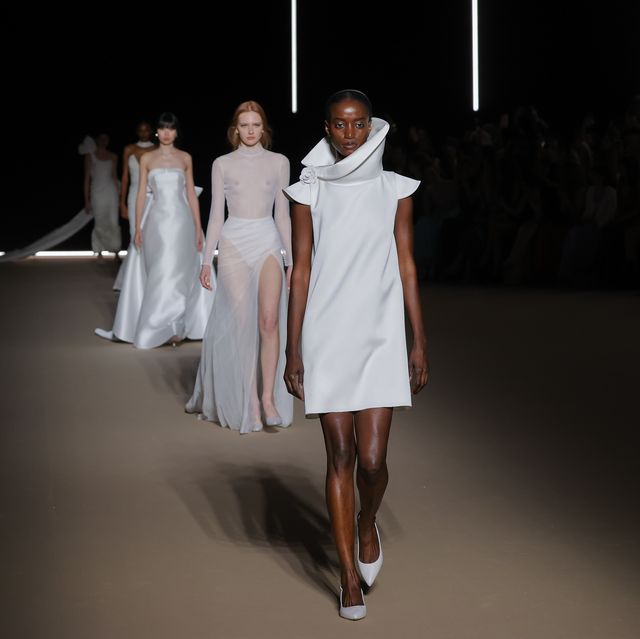 a group of people walking down a runway