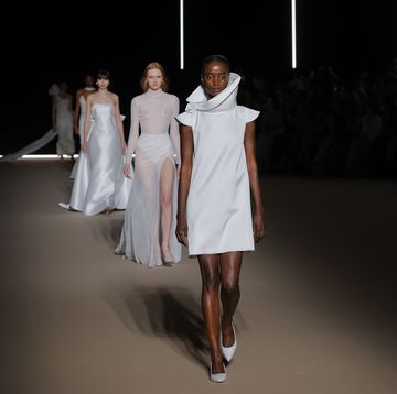 a group of people walking down a runway