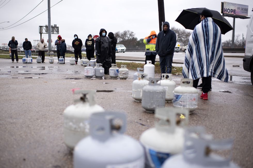 houston, tx   february 17 propane tanks are placed in a line as people wait for the power to turn on to fill their tanks in houston, texas on february 17, 2021photo by mark felix for the washington post via getty images
