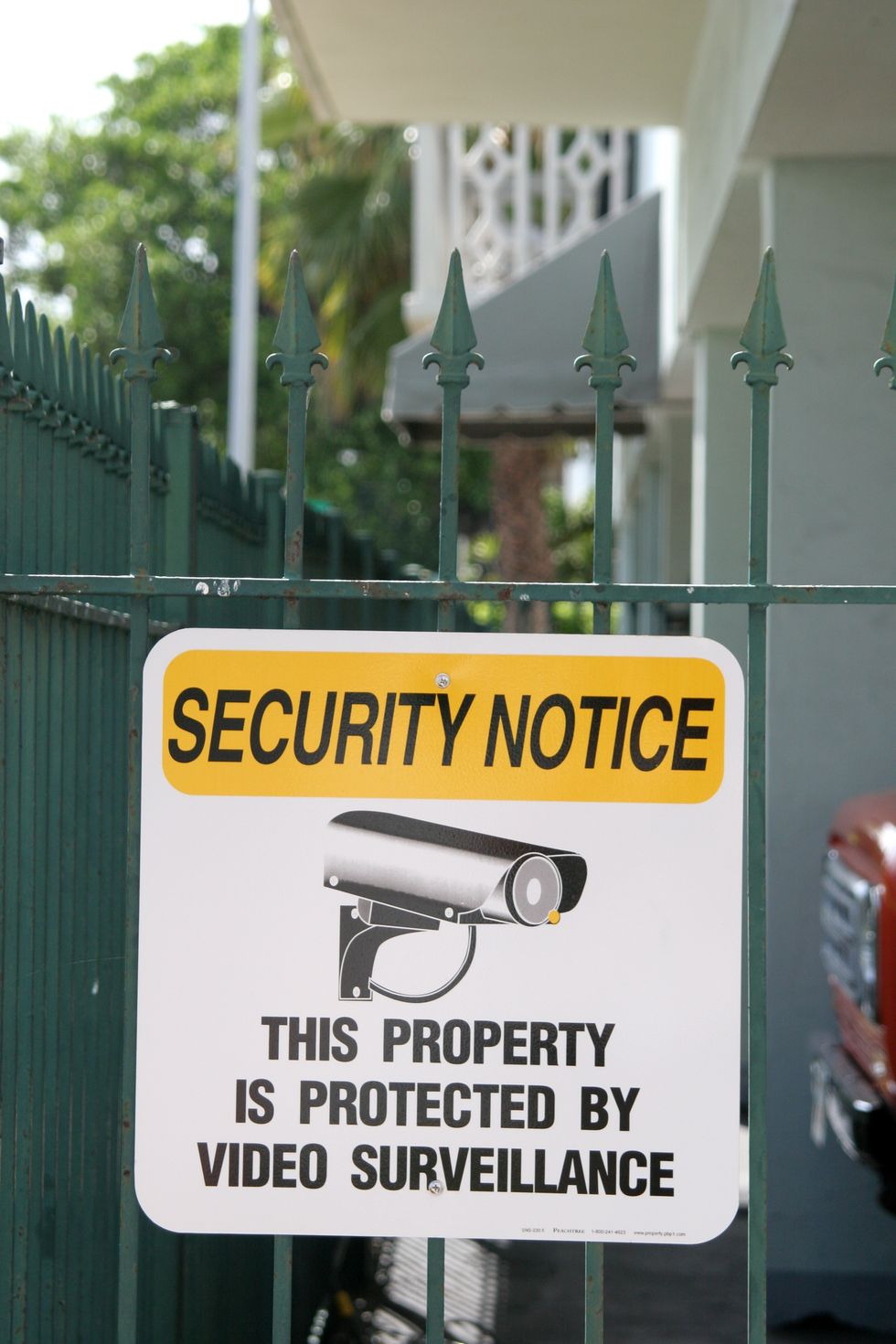 A property protected sign on a condominium fence at South Beach.