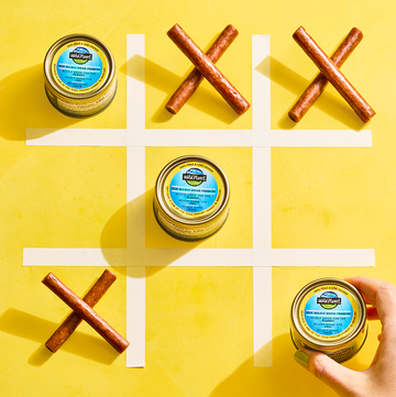 Jerky sticks and tinned tuna in a tic tac toe board jerky sticks and tinned tuna in a tic tac toe board