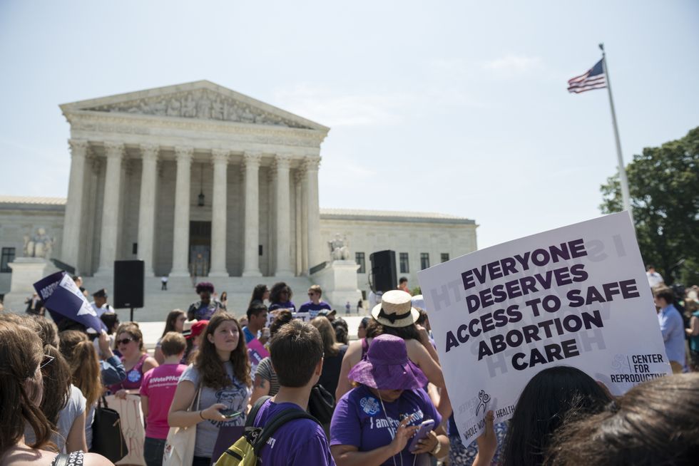 washington dc, usa   june 27, 2016 pro choice supporters stand in front of the us supreme court after the court, in a 5 3 ruling in the case whole womans health v hellerstedt, struck down a restrictive texas abortion access law