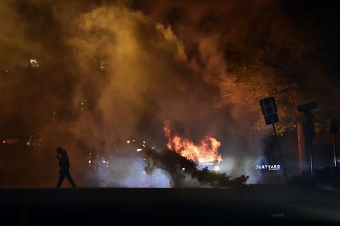 a police suv was vandalized then set on fire during the protest thousands of people gathered saturday, may 30, 2020, at the country club plaza for a second night of protests against police brutality and the death of george floyd