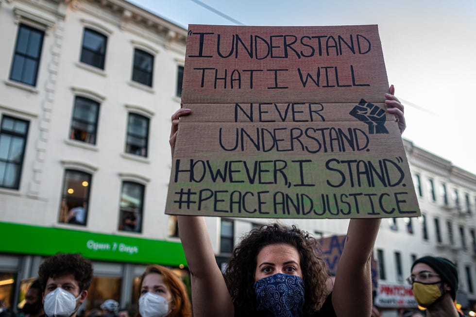 sign that reads 'i understand that i will never understand however, i stand peace and justice'