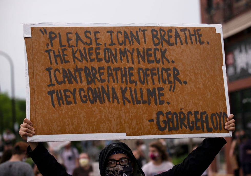 protest sign that displays george floyd's last words