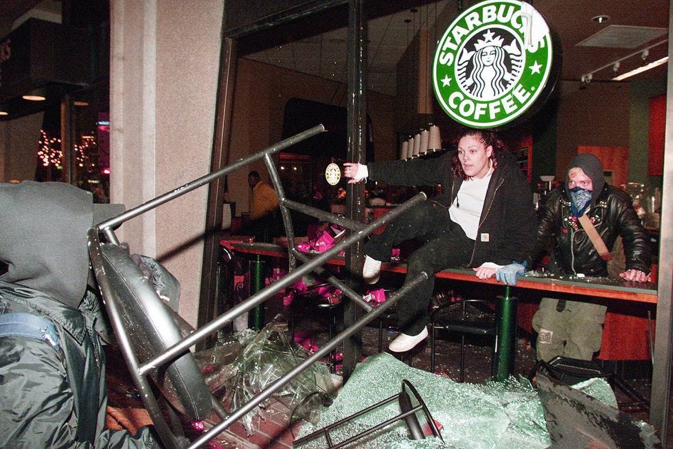 Protesters break and trash a Starbucks coffee shop
