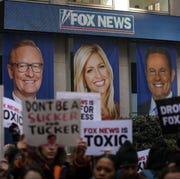 protesters-rally-against-fox-news-outside-the-fox-news-news-photo-1676658150.jpg?crop=0.670xw:1.00xh;0.196xw,0&resize=180:*
