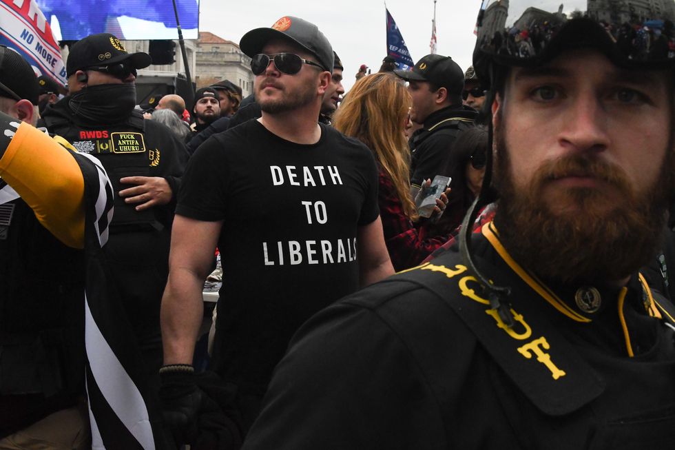 washington, dc   december 12 a member of the proud boys wearing a t shirt that reads "death to liberals" stands with other proud boys in freedom plaza during a protest on december 12, 2020 in washington, dc thousands of protesters who refuse to accept that president elect joe biden won the election are rallying ahead of the electoral college vote to make trump's 306 to 232 loss official  photo by stephanie keithgetty images