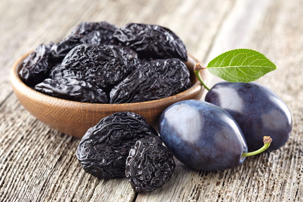 plums with prunes on a wooden board