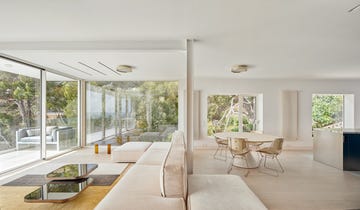 a living room with a large glass door