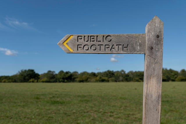 A Wooden Footpath Sign Post Indicating A Public Footpath England