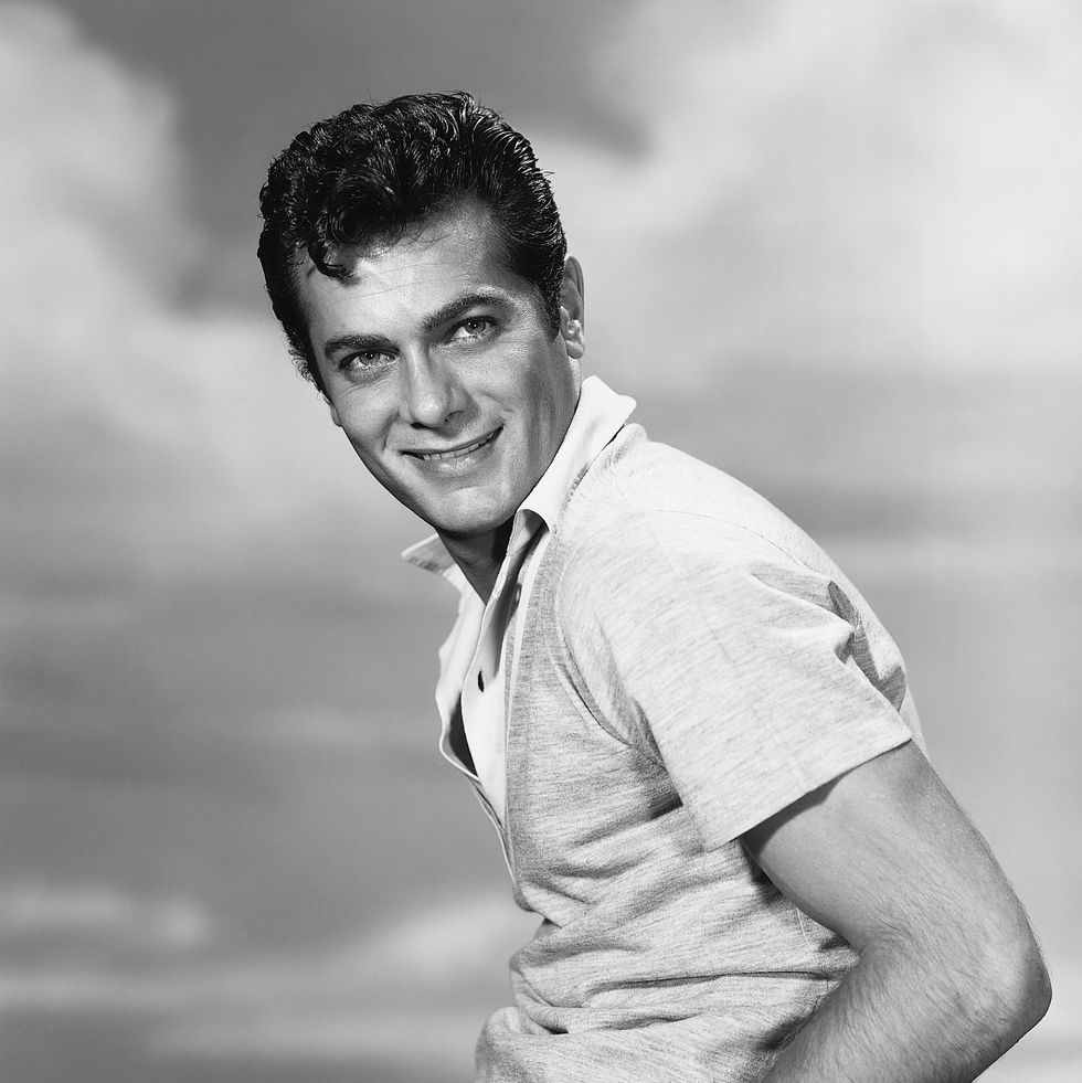 (original caption) publicity portrait of american actor tony curtis (b. 1925). he is shown waist up, seated sideways, looking toward the camera. photo copywright 1955.