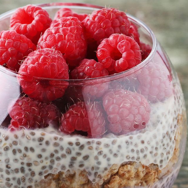 chia pudding with berries in glass on wooden table