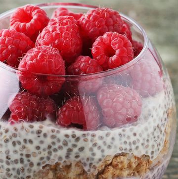 chia pudding with berries in glass on wooden table