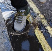 Footwear, Shoe, Jeans, Road surface, Asphalt, Reflection, Plimsoll shoe, Leg, Sidewalk, Shadow, 