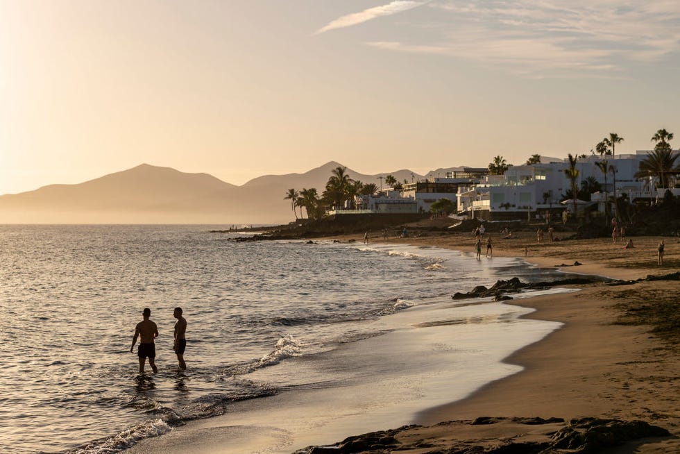 Two men on the beach in Puerto del Carmen