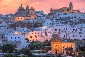 dusk light over the old town of ostuni, nicknamed the white city of salento, in brindisi province, apulia region, southern italy
