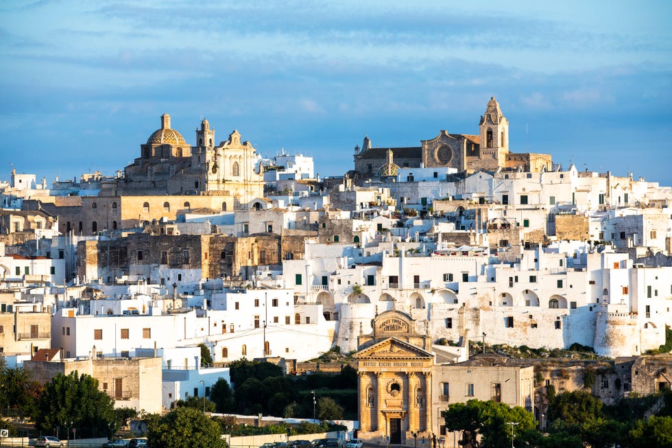 view of the city of ostuni during sunset, puglia , italy