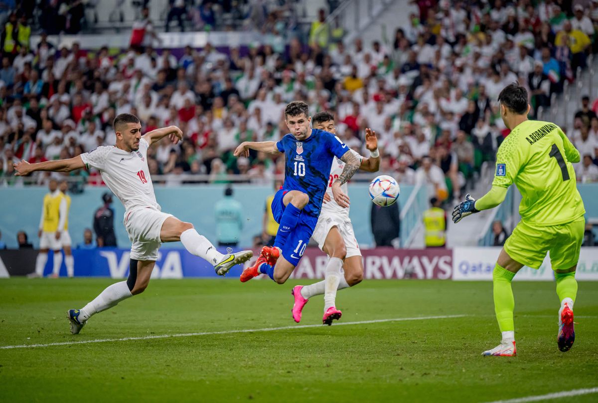 doha, qatar   november 29 christian pulisic c of usa scores his team's first goal past majid hosseini l, alireza beiranvand r and amir abedzadeh of iran during the fifa world cup qatar 2022 group b match between ir iran and usa at al thumama stadium on november 29, 2022 in doha, qatar photo by marvin ibo guengoer   ges sportfotogetty images