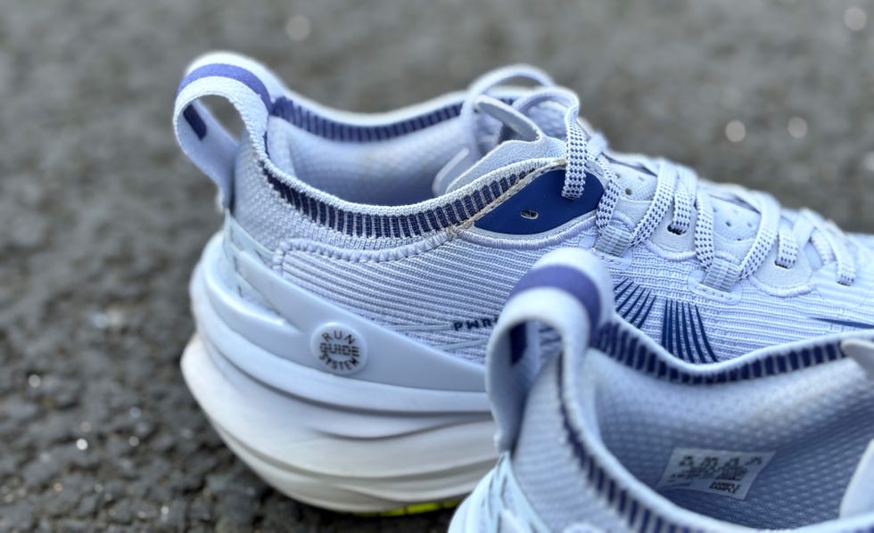 rear shot of a purple puma running shoe with a thick padded heel