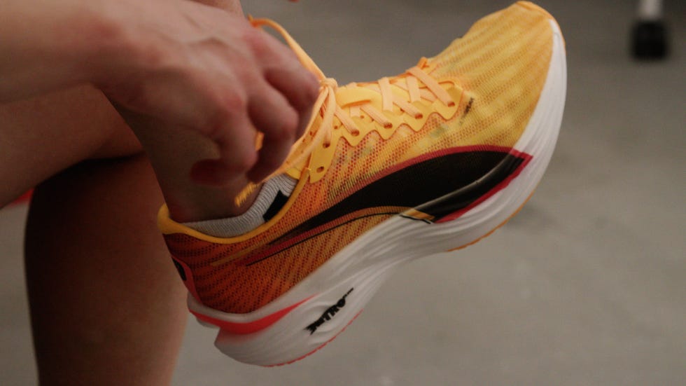 puma shoe being laced up on a foot