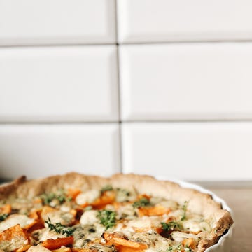 pumpkin and blue cheese tart on a kitchen worktop