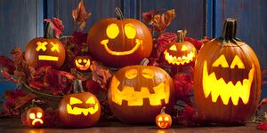 a group of jack o lanterns lit up for the holiday