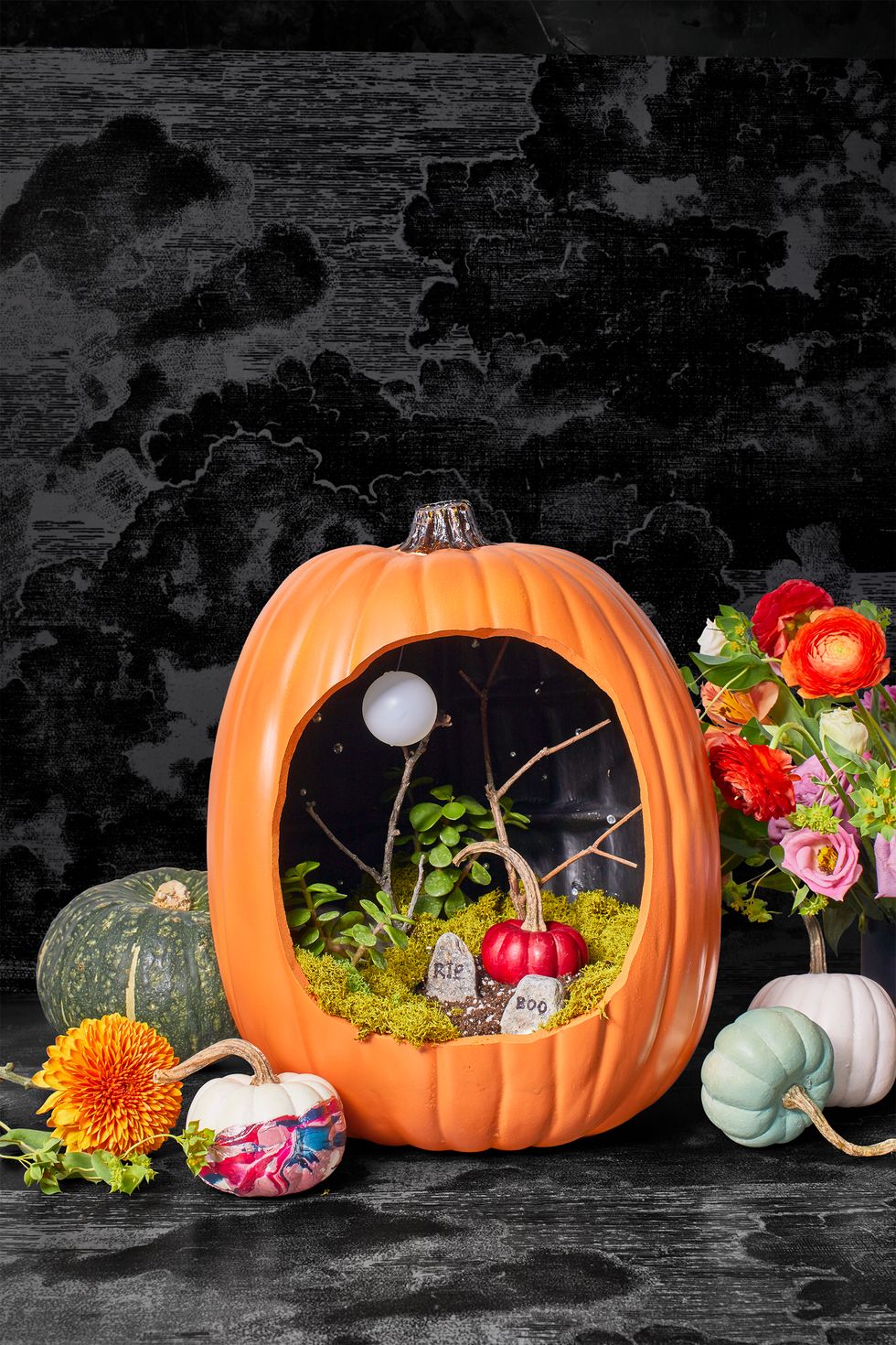 pumpkin carving ideas, carved out pumpkin with a gravestone scene inside, diorama