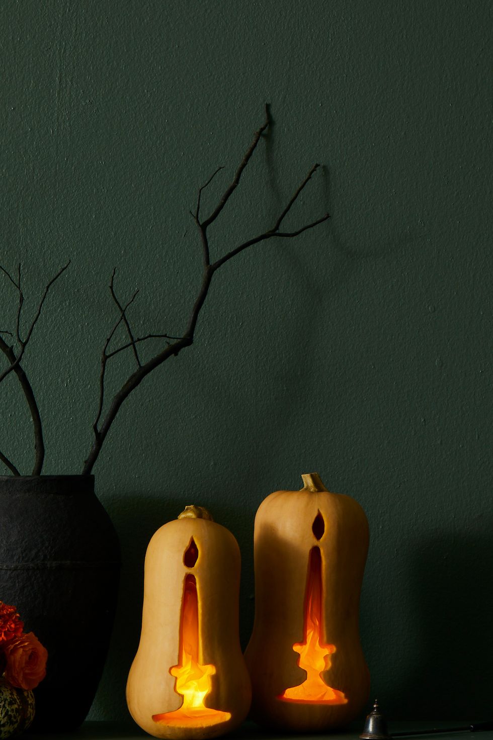 pumpkin carving ideas, two pumpkins on the mantel carved to look like candles