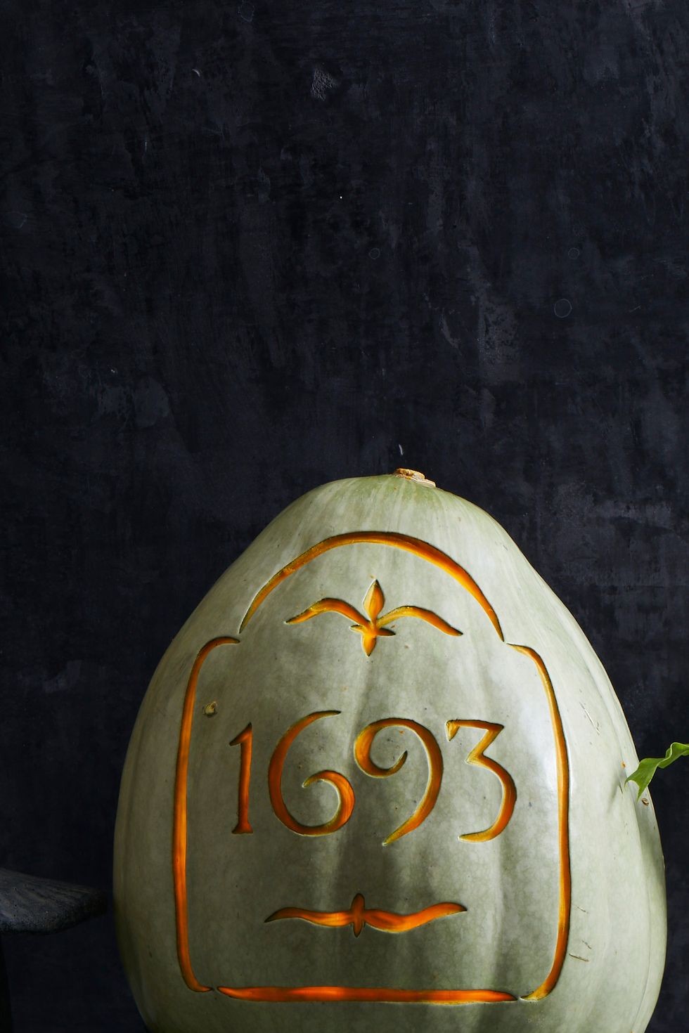 pumpkin carving ideas, white pumpkin carved with numbers to resemble a tombstone