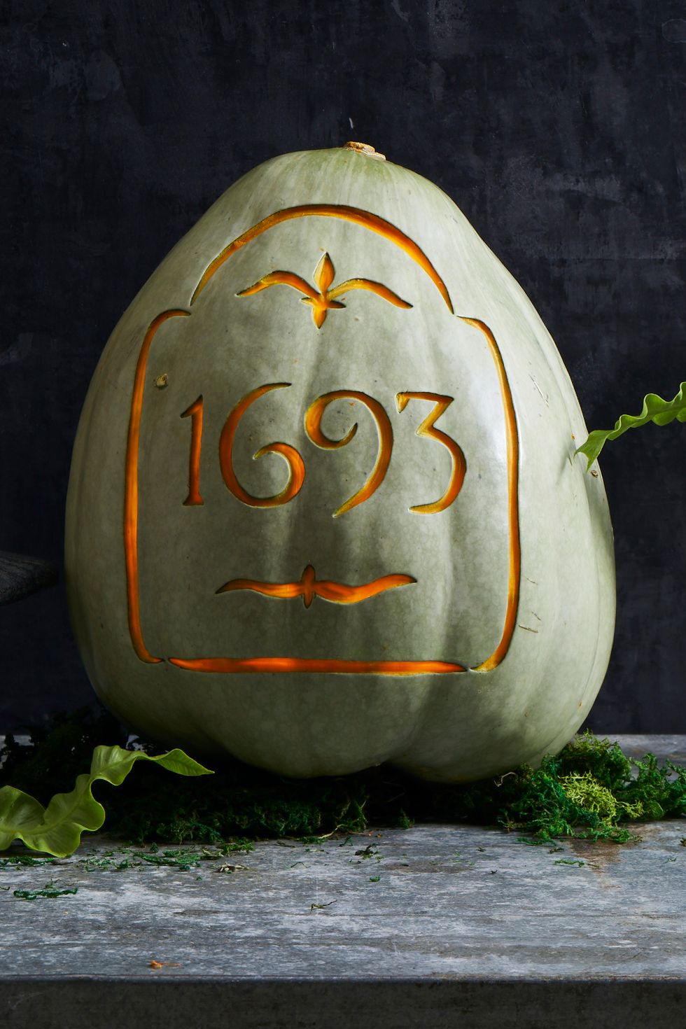 pumpkin carving ideas, white pumpkin carved with numbers to resemble a tombstone
