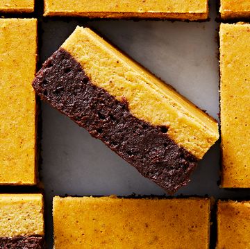brownies with a chocolate layer and pumpkin cheesecake layer